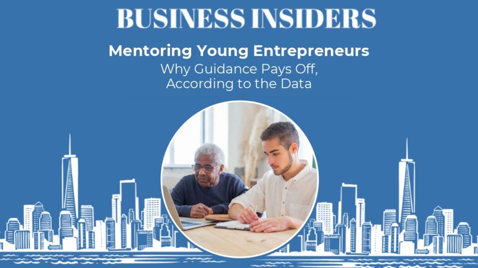 Experienced business mentor working with a young entrepreneur at a laptop